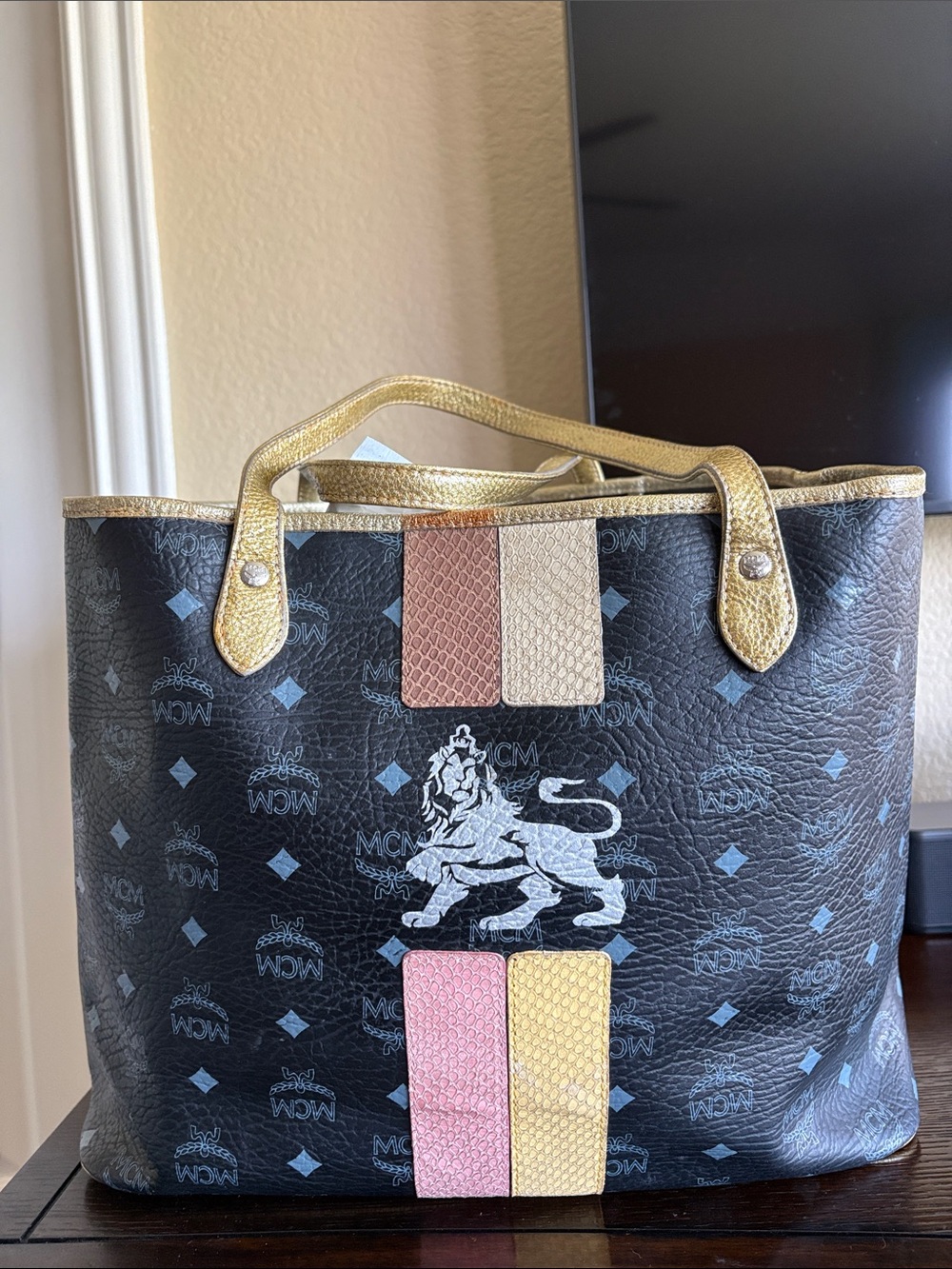 MCM Black Logo Tote with Gold Trim and Pink, Tan, Yellow Accents
